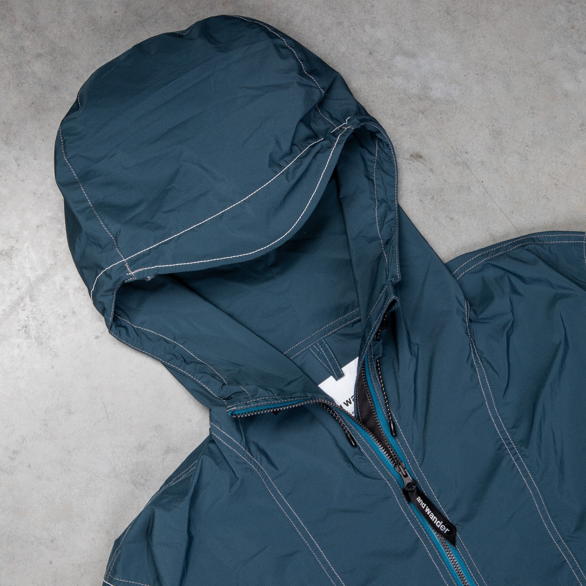 And Wander Pertex Wind Jacket Dark Blue