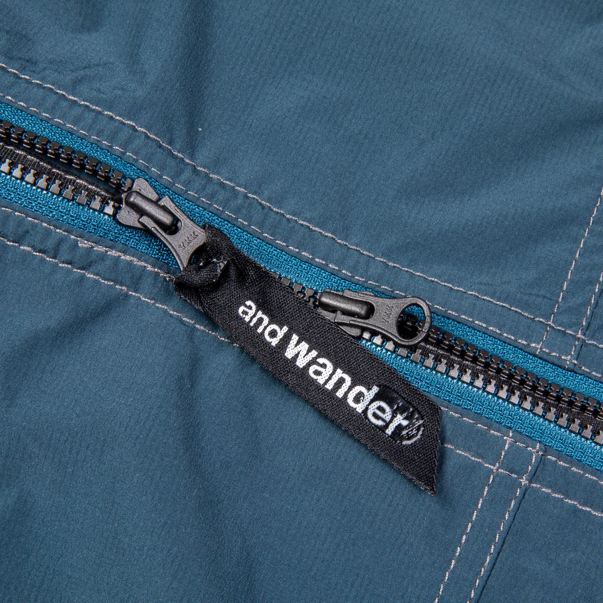 And Wander Pertex Wind Jacket Dark Blue