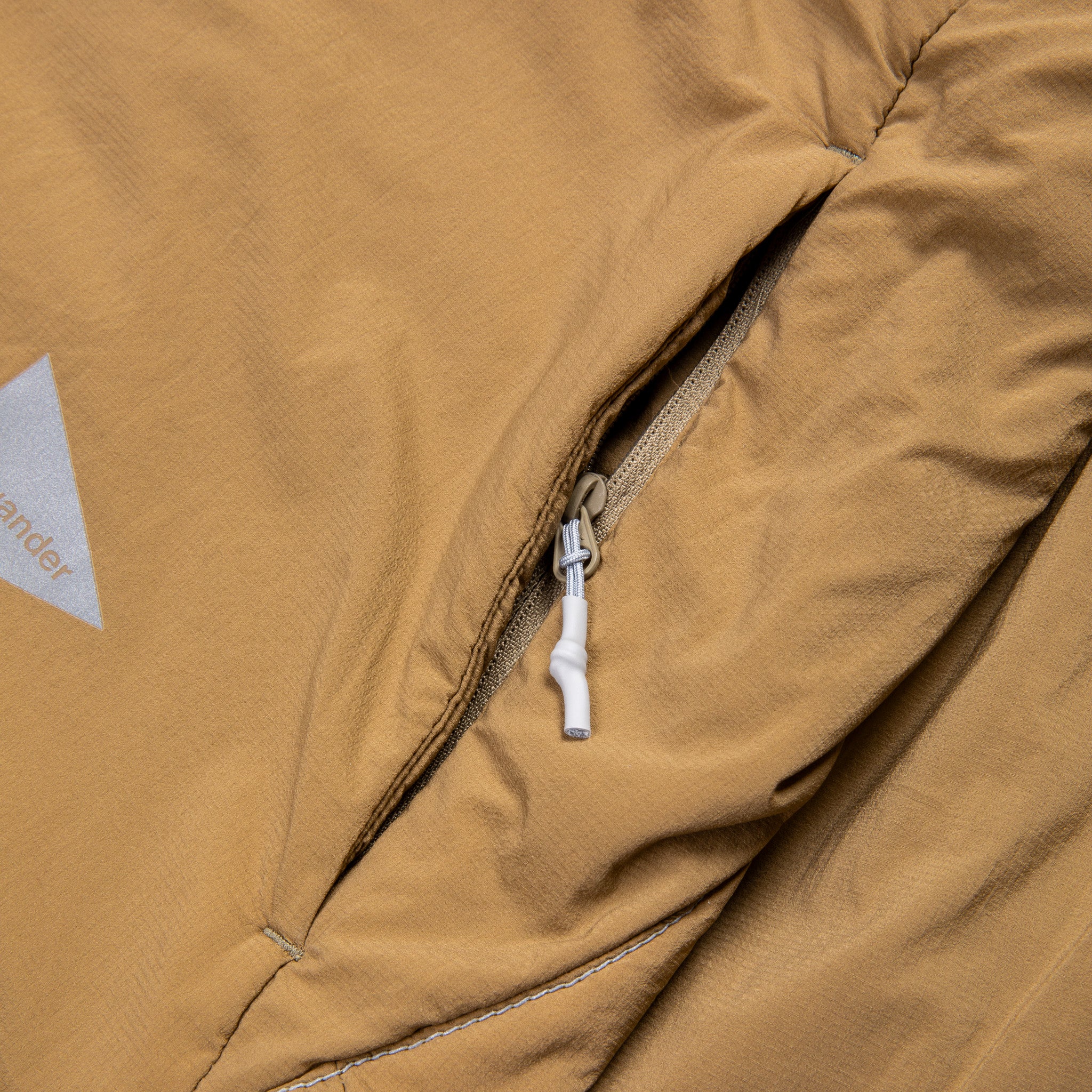 And Wander Alpha Air Jacket Beige