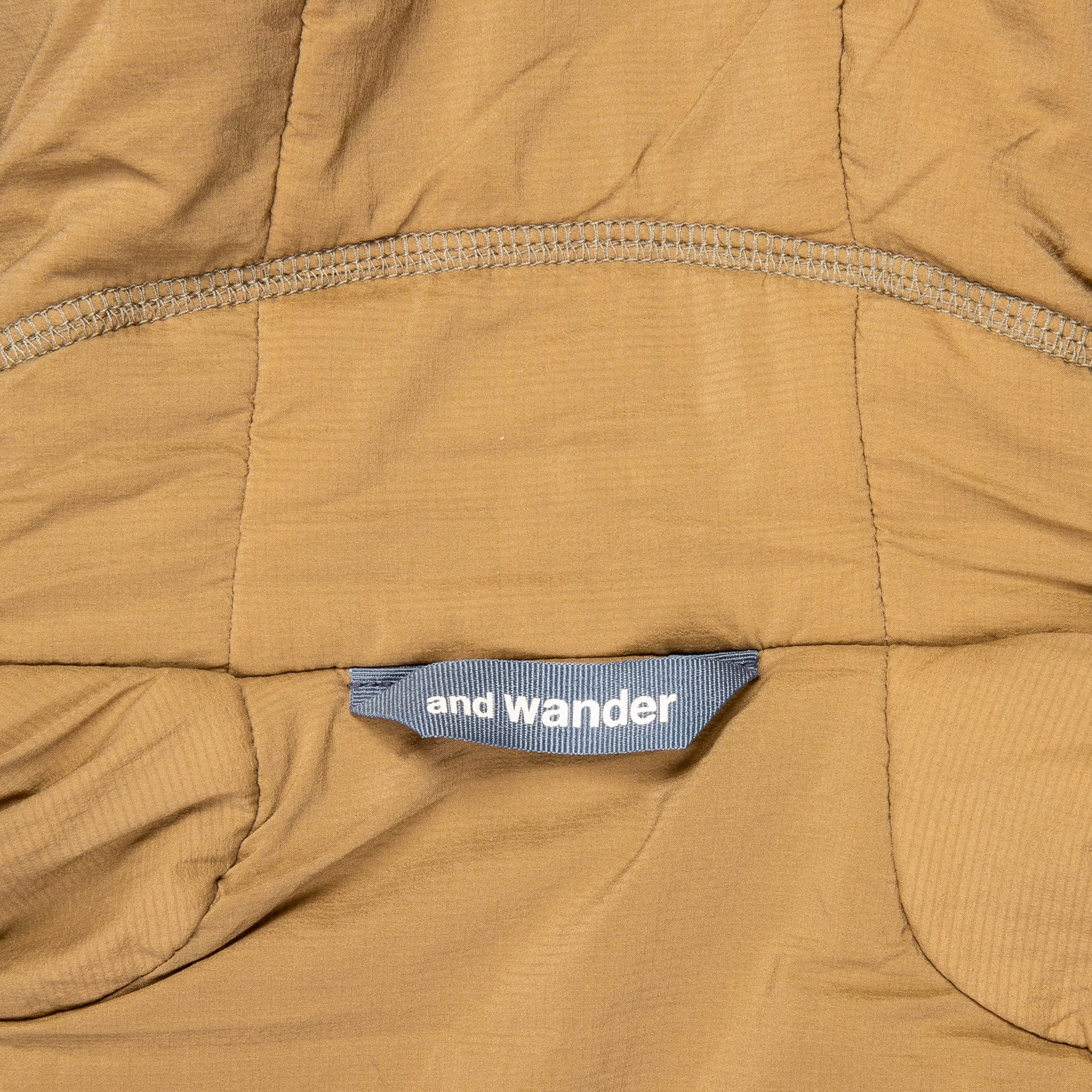 And Wander Alpha Air Jacket Beige