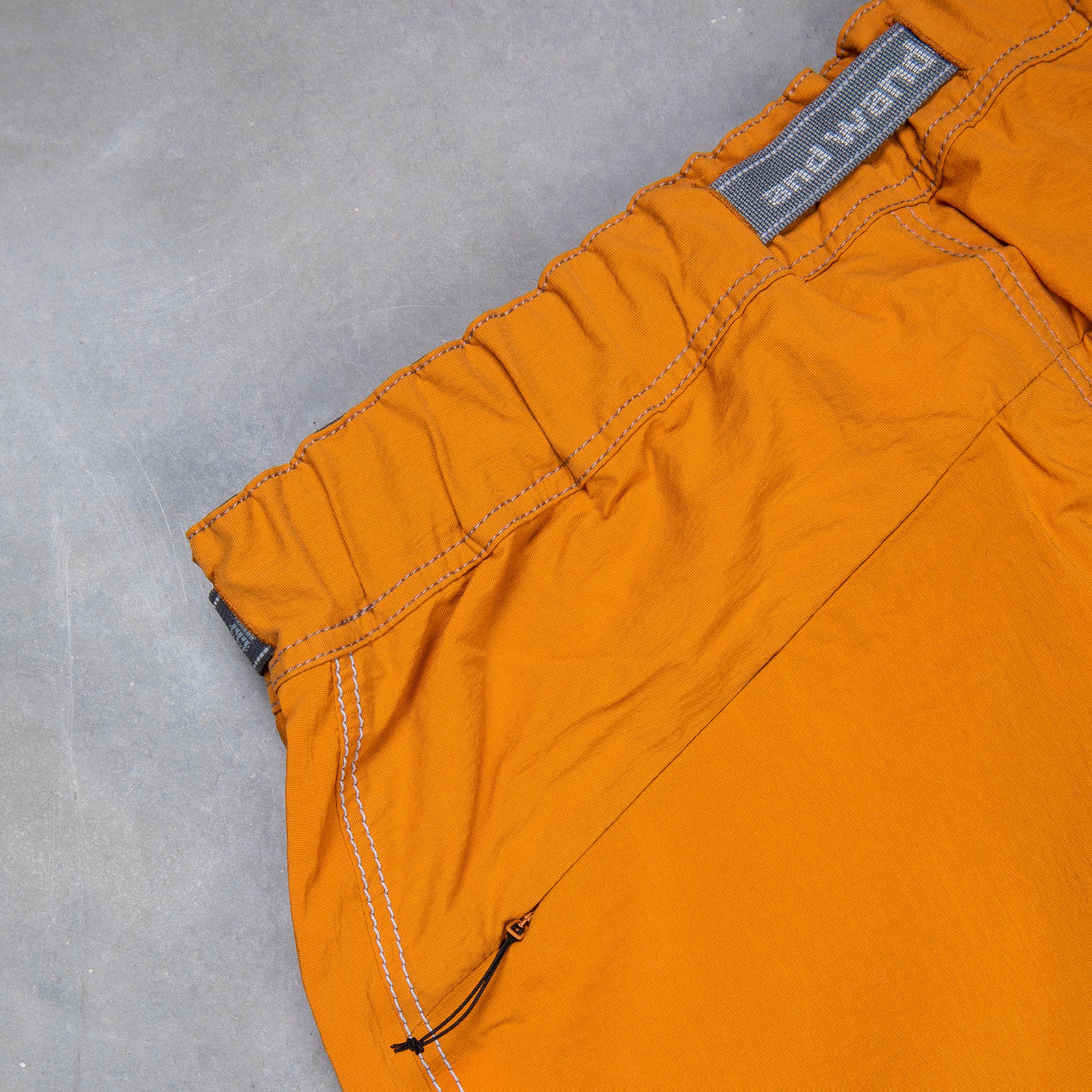 And Wander Light Hike Shorts Orange