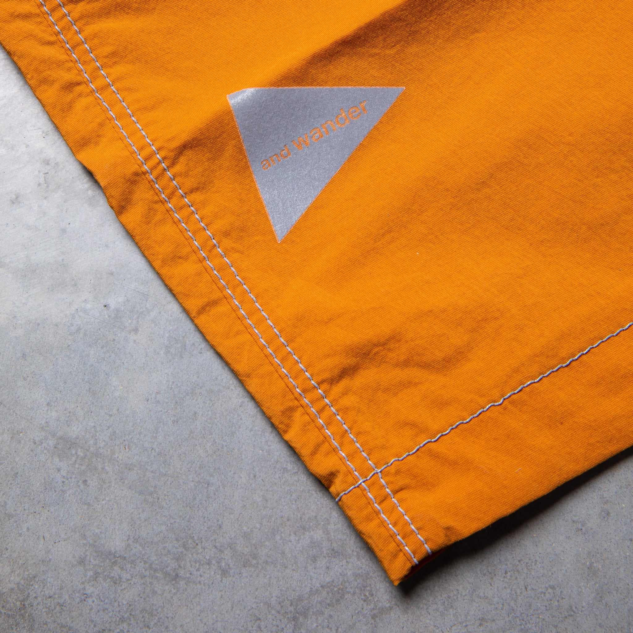 And Wander Light Hike Shorts Orange