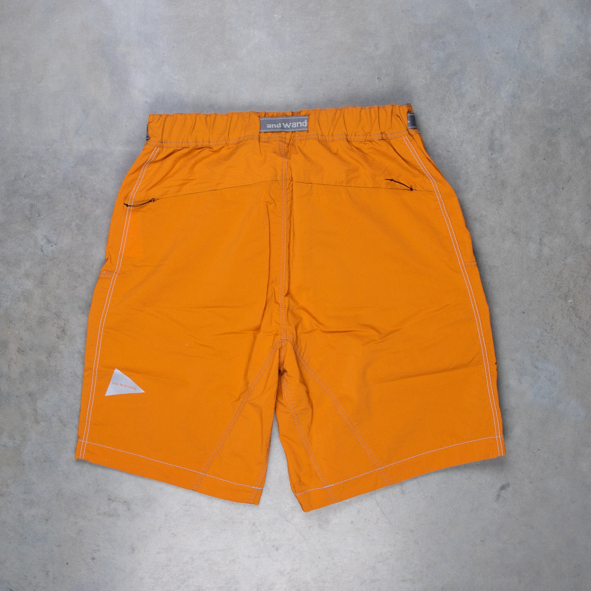 And Wander Light Hike Shorts Orange