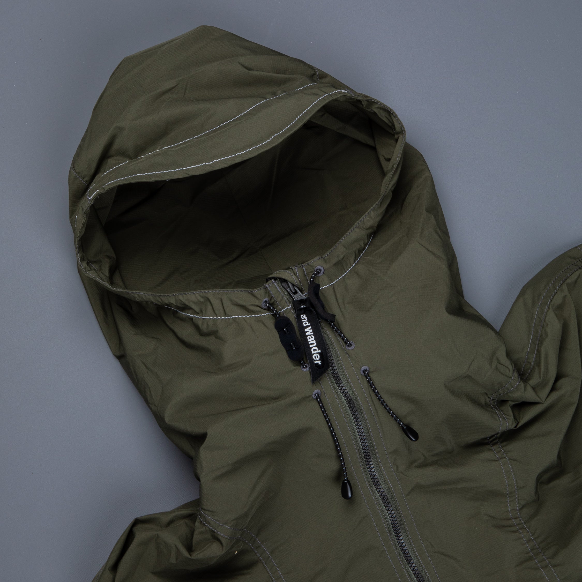 And Wander Pertex wind jacket khaki – Frans Boone Store