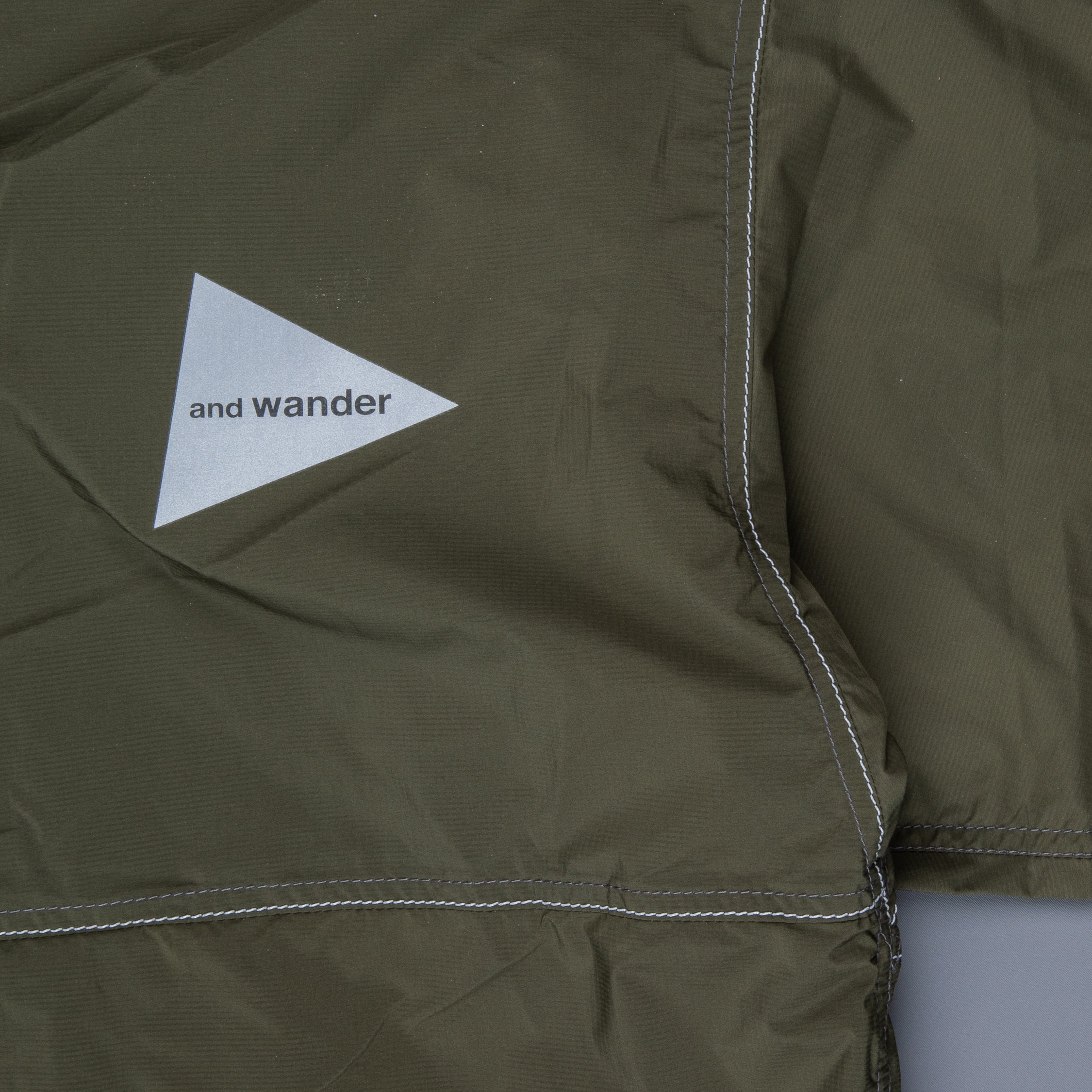 And Wander Pertex wind jacket khaki
