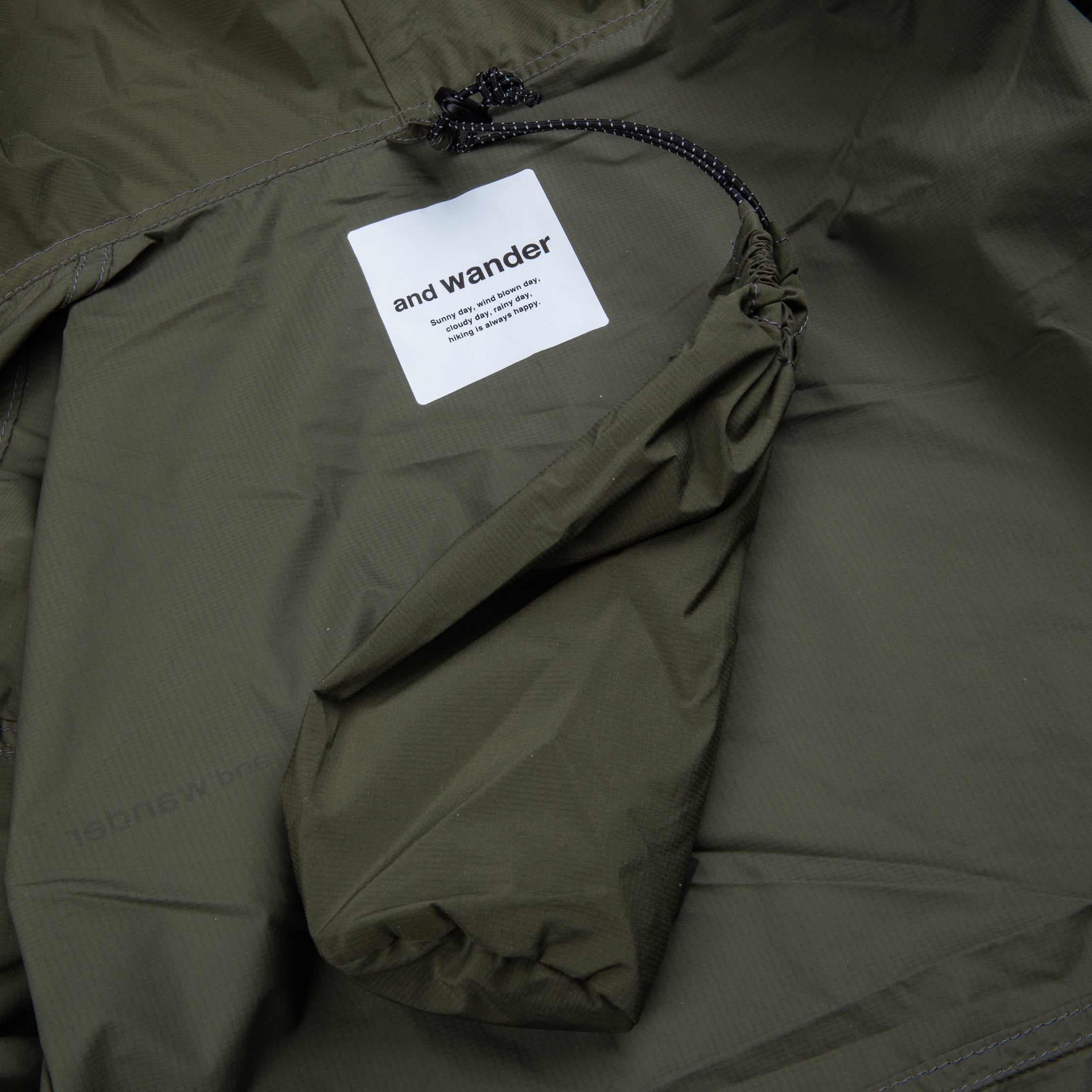 And Wander Pertex wind jacket khaki